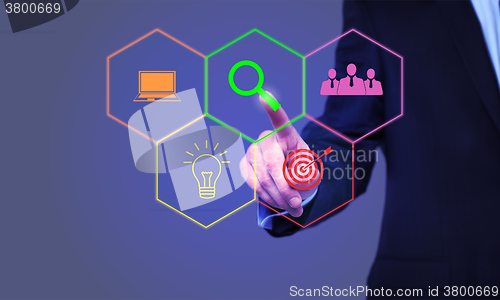 Image of businessman pressing Search button on virtual screens