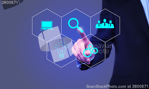 Image of businessman pressing Search button on virtual screens