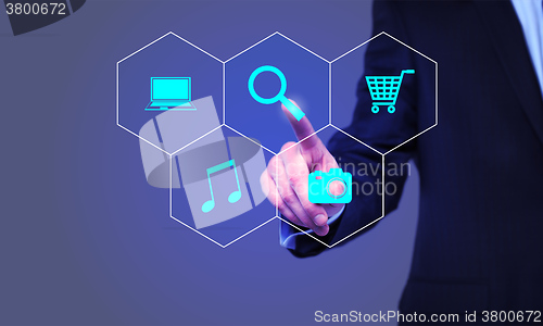 Image of business, technology and internet concept - businessman pressing Search button on virtual screens