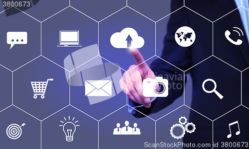 Image of businessman clicks cloud icon on the virtual screen