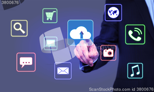 Image of businessman clicks cloud icon on the virtual screen