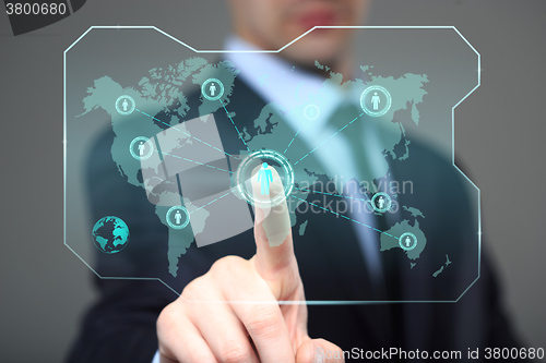 Image of technology and internet concept - businessman pressing button on virtual screens