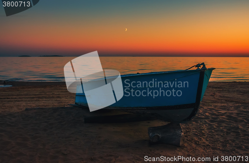 Image of Boat on the beach at sunset background