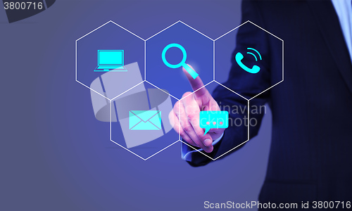 Image of businessman pressing Search button on virtual screens