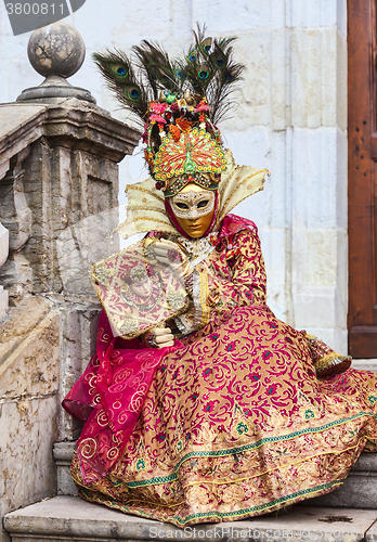 Image of Disguised Person Sitting on the Steps