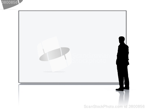Image of man in front of a big white screen
