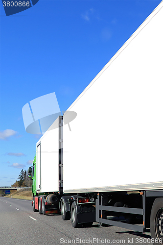 Image of Cargo Truck with White Trailers on Motorway