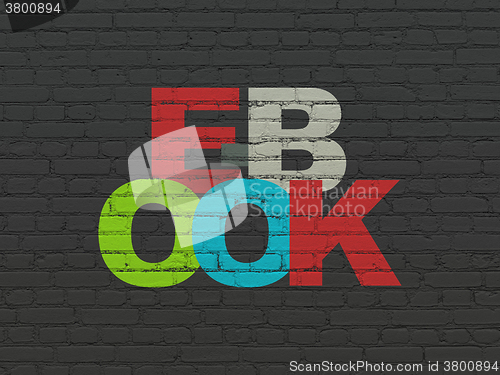 Image of Education concept: E-Book on wall background