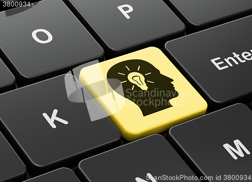 Image of Advertising concept: Head With Light Bulb on computer keyboard background