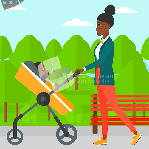 Image of Woman pushing pram.