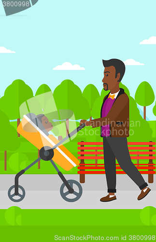 Image of Man pushing pram.