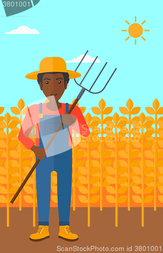 Image of Farmer with pitchfork.
