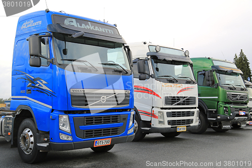 Image of Three Colorful Volvo Trucks