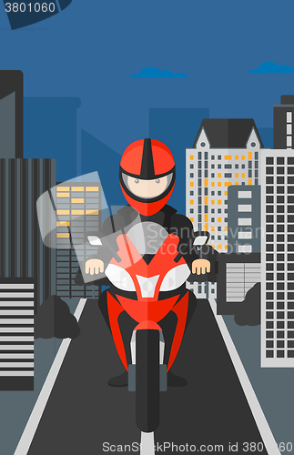 Image of Man riding motorcycle.