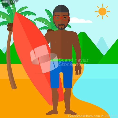 Image of Surfer holding surfboard.