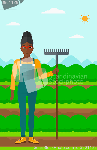 Image of Farmer with rake.