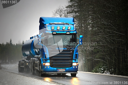 Image of Blue Scania R500 Tank Truck Trucking in Fog and Rain