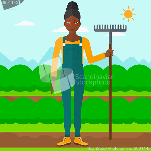 Image of Farmer with rake.