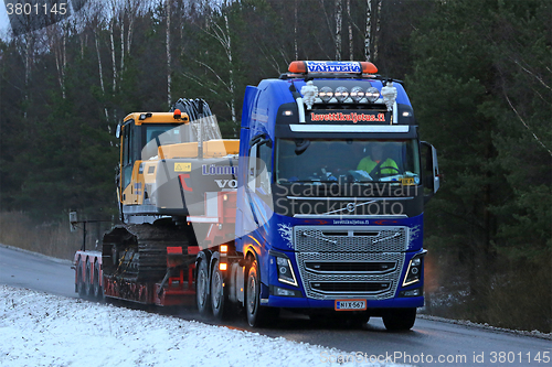 Image of Volvo FH16 Truck Hauls Crawler Excavator