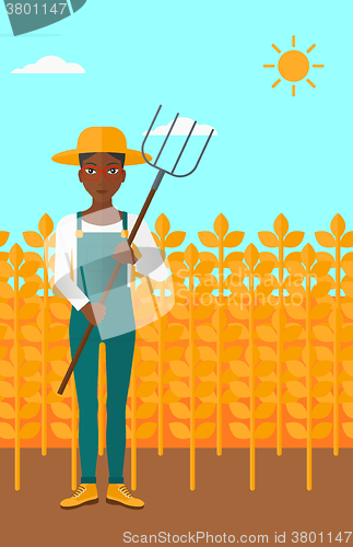 Image of Farmer with pitchfork.