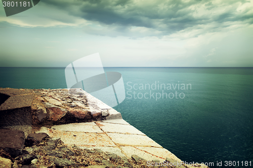 Image of View over stormy sea and clouds