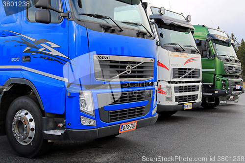 Image of Row of Colorful Volvo Trucks