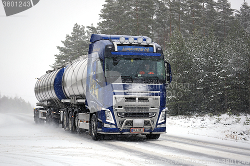 Image of Volvo FH Tank Truck on The Road in Snowfall