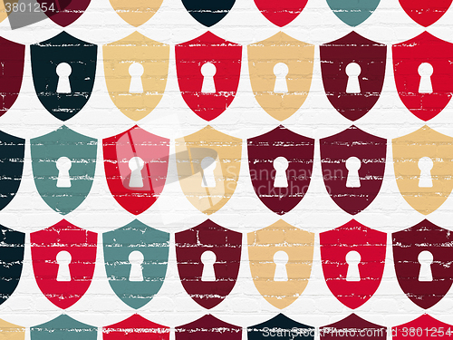 Image of Security concept: Shield With Keyhole icons on wall background