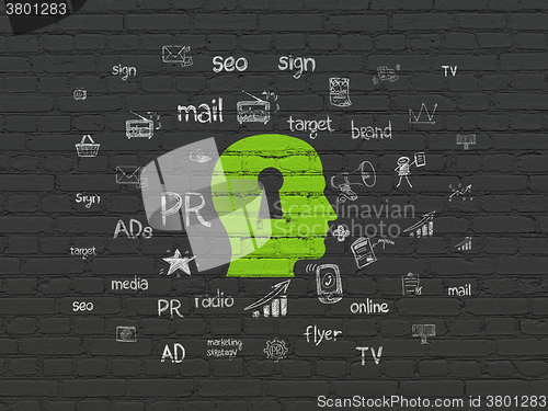 Image of Marketing concept: Head With Keyhole on wall background