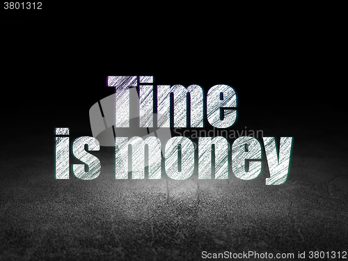 Image of Time concept: Time Is money in grunge dark room
