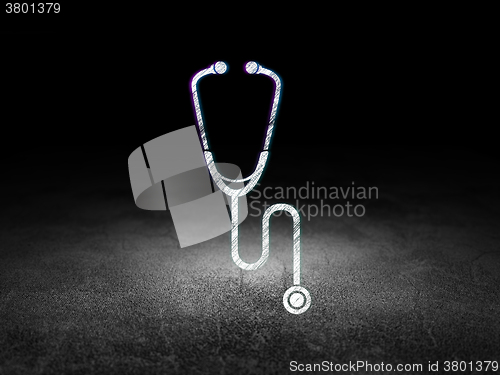 Image of Healthcare concept: Stethoscope in grunge dark room