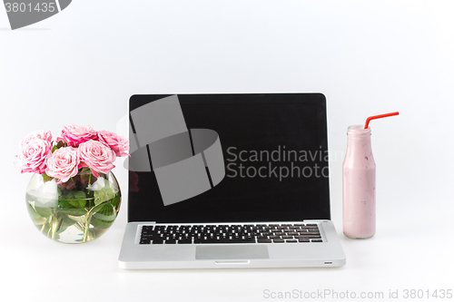 Image of Comfortable workplace with laptop on white