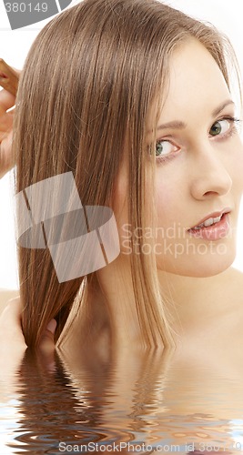 Image of combing woman in water