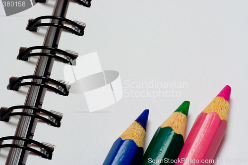 Image of Color pencils on a notepad

