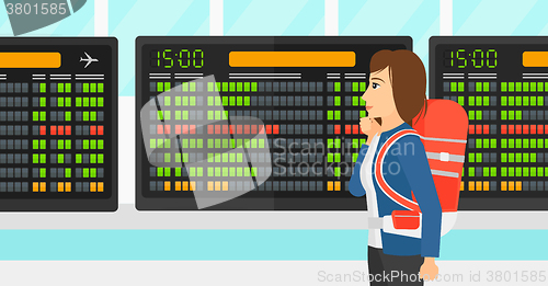 Image of Woman looking at schedule board.