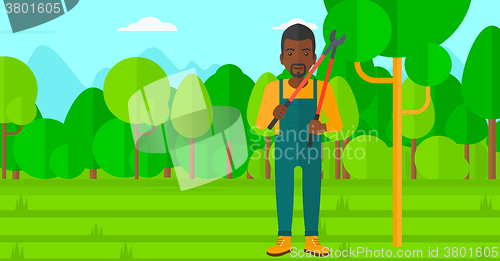 Image of Farmer with pruner in garden.
