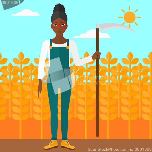 Image of Farmer on the field with scythe.