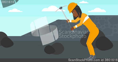 Image of Miner working with pick.