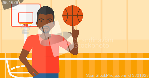 Image of Basketball player spinning ball.