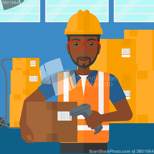 Image of Worker checking barcode on box.