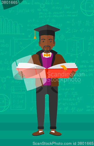 Image of Man in graduation cap holding book.