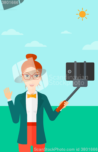 Image of Woman making selfie.