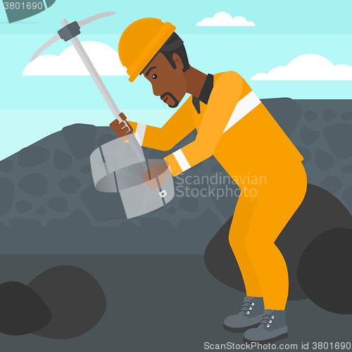 Image of Miner working with pick.