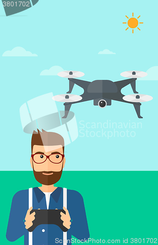 Image of Man flying drone.