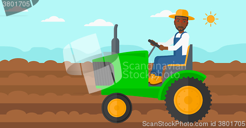 Image of Farmer driving tractor.