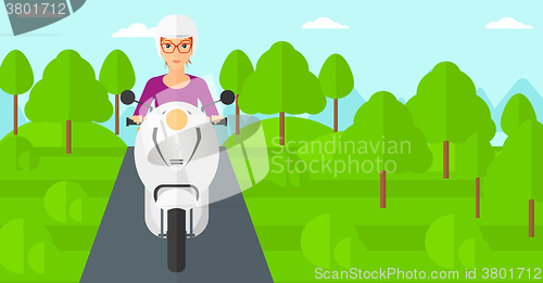 Image of Woman riding scooter.