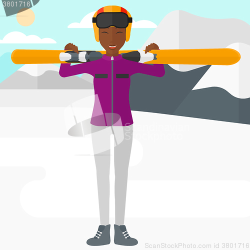 Image of Woman holding skis.