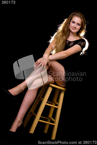 Image of Woman on stool