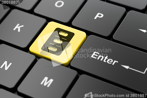 Image of Medicine concept: Pills Blister on computer keyboard background