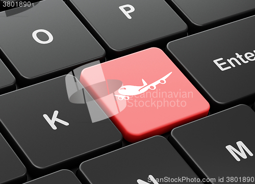 Image of Tourism concept: Airplane on computer keyboard background